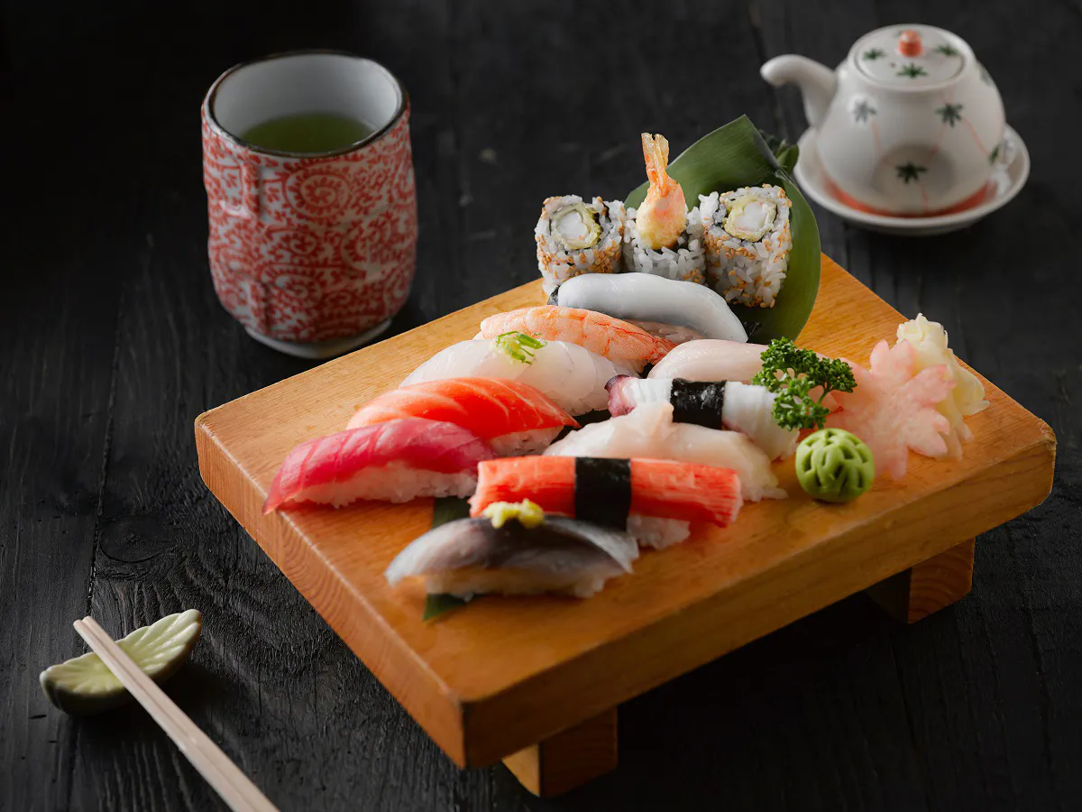Assorted nigiri sushi platter with green tea and teapot at Sushi One，a Japanese Restaurant in Portland
