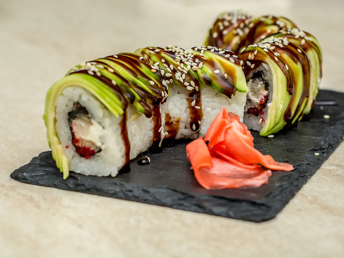 Avocado-topped sushi rolls with eel sauce and sesame seeds at Sushi One，a Japanese Restaurant in Portland
